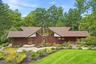 Designed by Westchester architect Roy Sigvard Johnson, this distinctive 1969 Mid-Century Modern residence showcases sculptural rooflines, dramatic ang