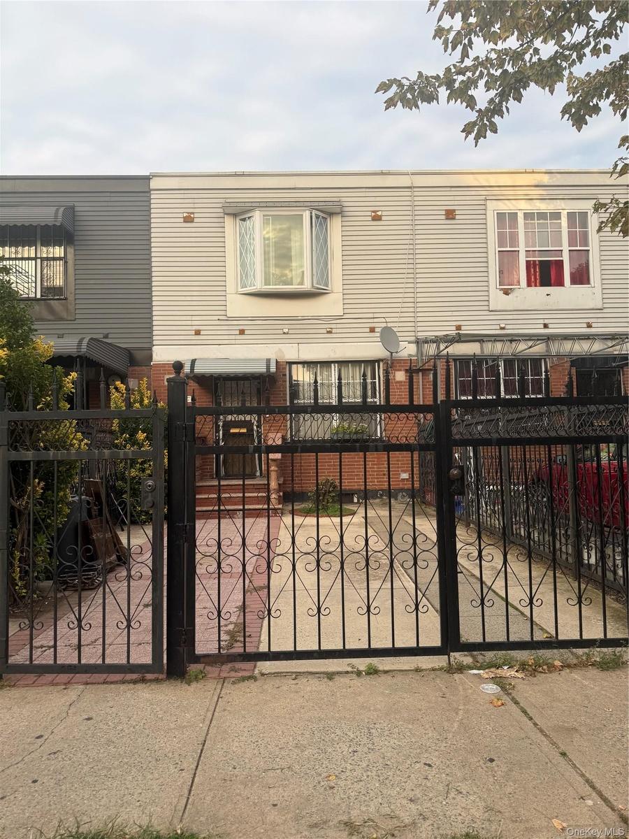 Gated front yard with parking