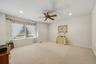 Recessed lighting, ceiling fan, and carpeted flooring