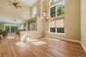 Soaring vaulted ceilings with wood-finish flooring