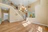Open area living room with access to stairs