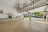 Epoxy-coated concrete flooring, two automatic garage door openers, and built-in shelving