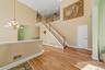 Open area living room with access to stairs