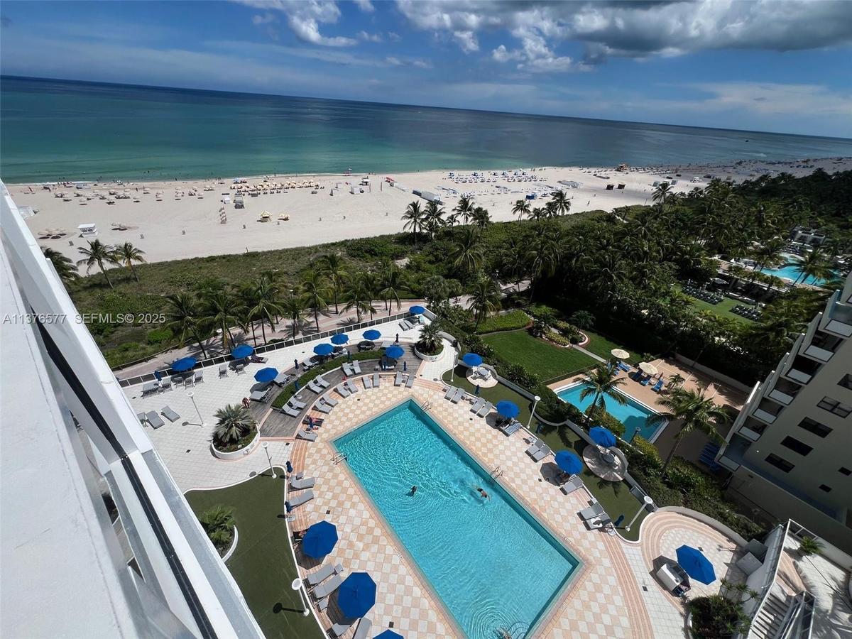 View to the pool and ocean from private balcony