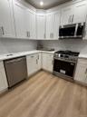 Kitchen w/White Shaker Cabs with Champagne Bronze Hardware