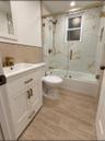 1st Floor Bathroom. Digitally Staged With Shower Doors
