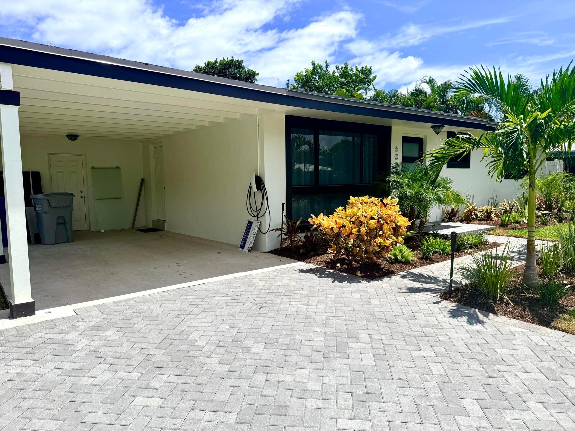 Front of home with carport and EV Charger