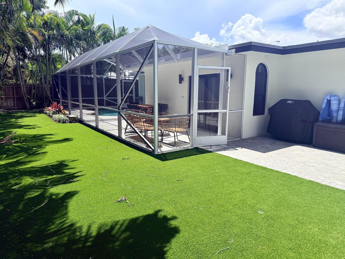 View of back patio with putting green