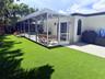 View of back patio with putting green