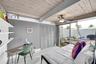 third bedroom with sliders to plunge pool and patio