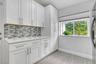 Cabinets are full with everything you need from fancy wine glasses to Tervis tumblers.