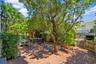 Beautifully lanscaped patio located on the ground level