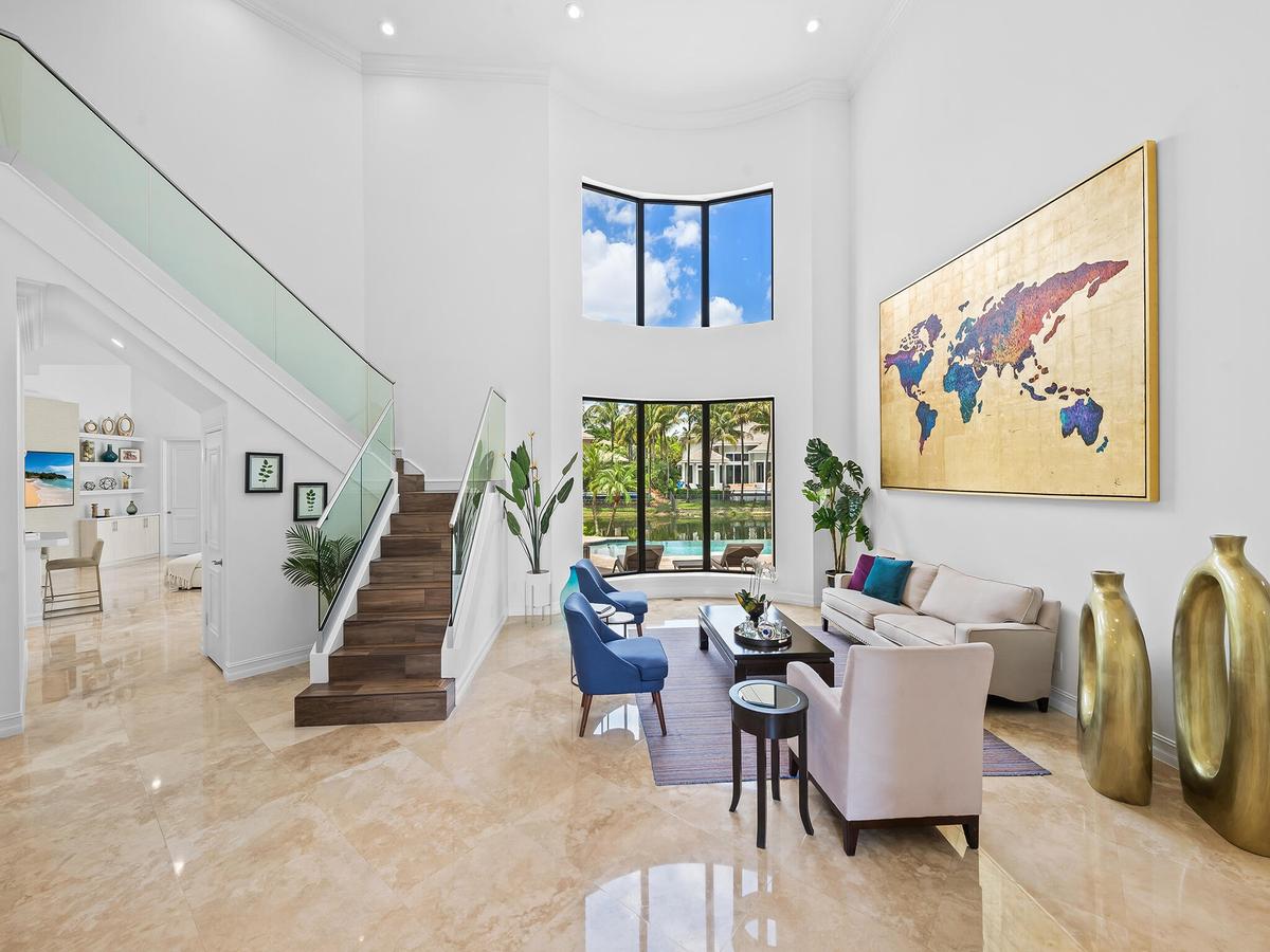 Living Room with Glass Stair Railings
