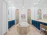 Primary Bath with Separate Vanities and Air Bath Tub