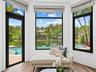 Primary Suite Sitting Area Overlooking Pool and Water View