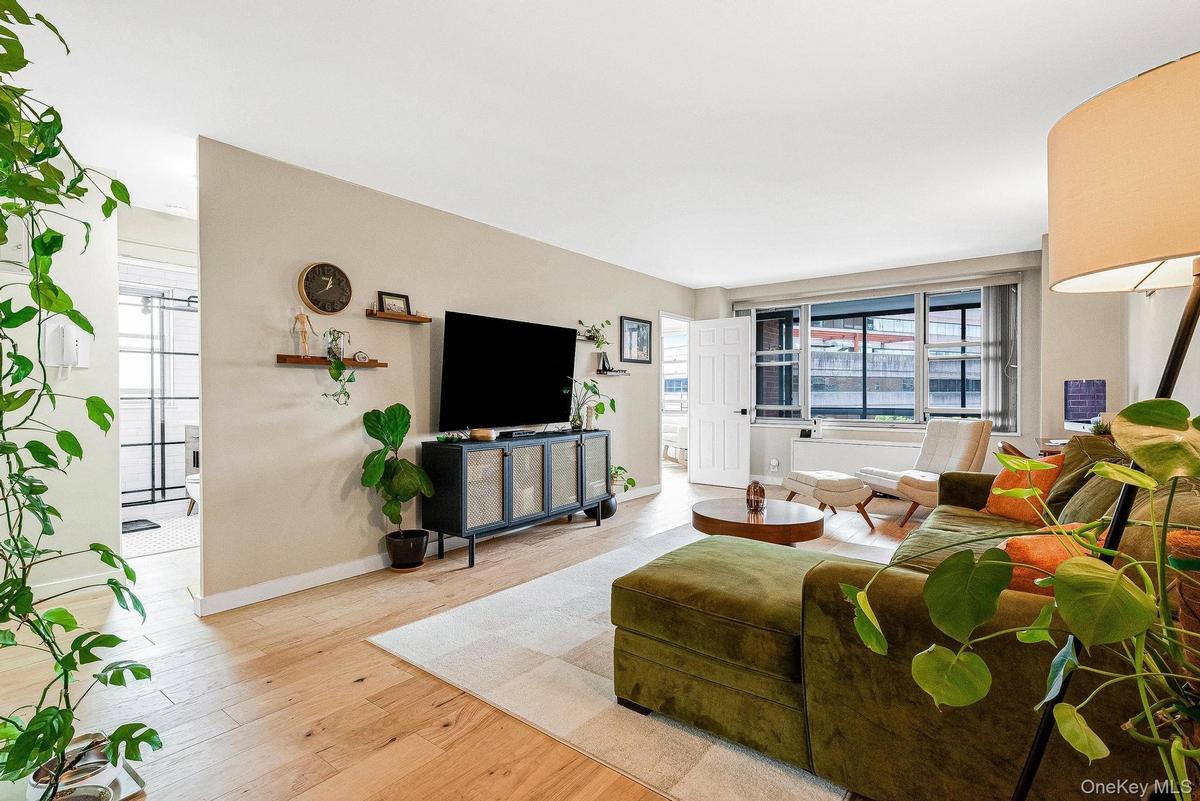Living room with wood finished floors and baseboards