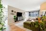 Living room with wood finished floors and baseboards