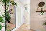 Bathroom featuring light wood-style flooring and electric panel