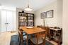 Dining room featuring light wood-style flooring and baseboards