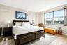 Bedroom with baseboards and wood finished floors