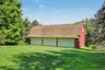 Detached six-car garage and barn (70' x 27') and each garage bay is 10' high x 20' wide.  Garage and barn has a full pine staircase which leads to the