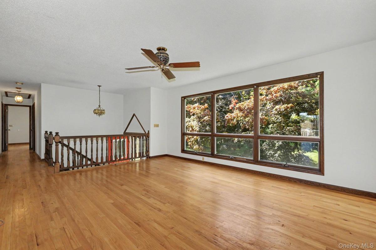 Living room with large windows and hardwood floors
