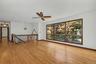 Living room with large windows and hardwood floors