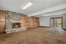 Walkout Family room with woodburning fireplace