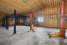 Detached six-car garage and barn (70' x 27') and each garage bay is 10' high x 20' wide.  Garage and barn has a full pine staircase which leads to the