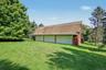 Detached six-car garage and barn (70' x 27') and each garage bay is 10' high x 20' wide.  Garage and barn has a full pine staircase which leads to the