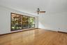 Living room with large windows and hardwood floors