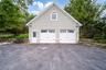 Two-car heated garage with finished upper level.  Perfect for Home based business, storage, extra guest space (with some work) or a workshop.