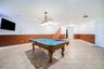 Spacious recreation area featuring tile flooring, recessed lighting, and a built-in sound system
