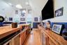 Built-in wet bar with integrated appliances, including refrigeration, a sink and a built-in media console.
