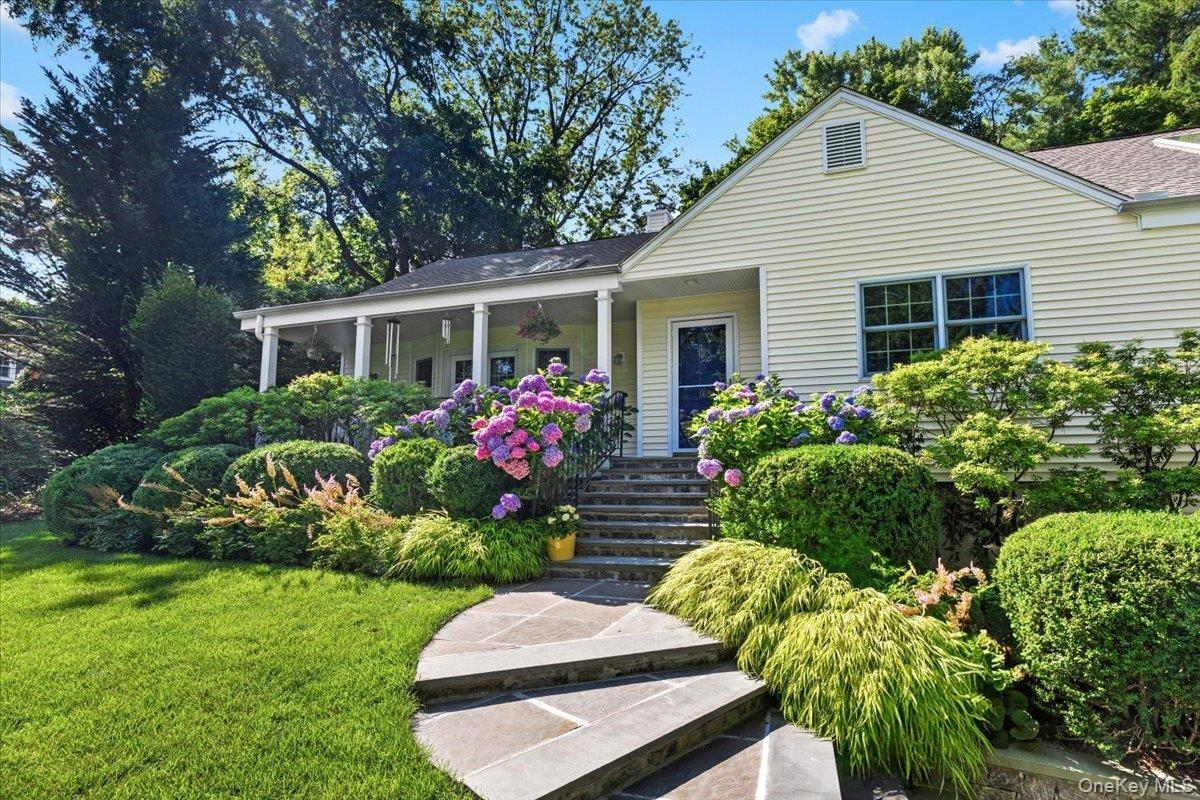 Stone walkway leading to gracious 4BR/3Bth, updated with many upgrades