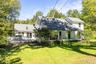 Exterior siding, covered front porch, skylights, pitched roof, and outdoor deck