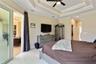 The hall leads to his and her closets then into the bathroom. Pocket doors separate the bathroom from the closet space. Notice the tray ceiling with l