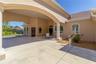 The parking arch not only protects you from the elements but adds a stately feel to the home. The door on the left leads to the dedicated office. The 