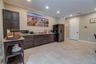 This is the other half of the gathering room and where the sellers served their guests breakfast each morning. The custom cabinets are maple. The coun