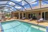 The pool area! This is a heated, saltwater pool. Notice the huge sliders that lead into the great room. Opening those fully really brings the outside 