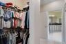One of two closets in the primary bedroom. The door to the left leads to the great room. Pocket doors separate the primary bathroom from the rest of t