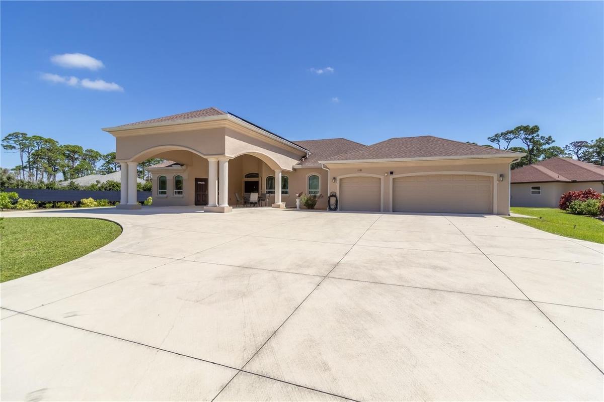 The main home has a 3 car garage, office, three bedrooms, two bathrooms and so much more.