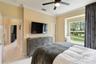 Bedroom three. The pocket door to the right leads to the walk-in closet. And those window seats!