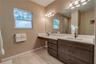 Two sinks for ADA compability. These are custom maple cabinets.