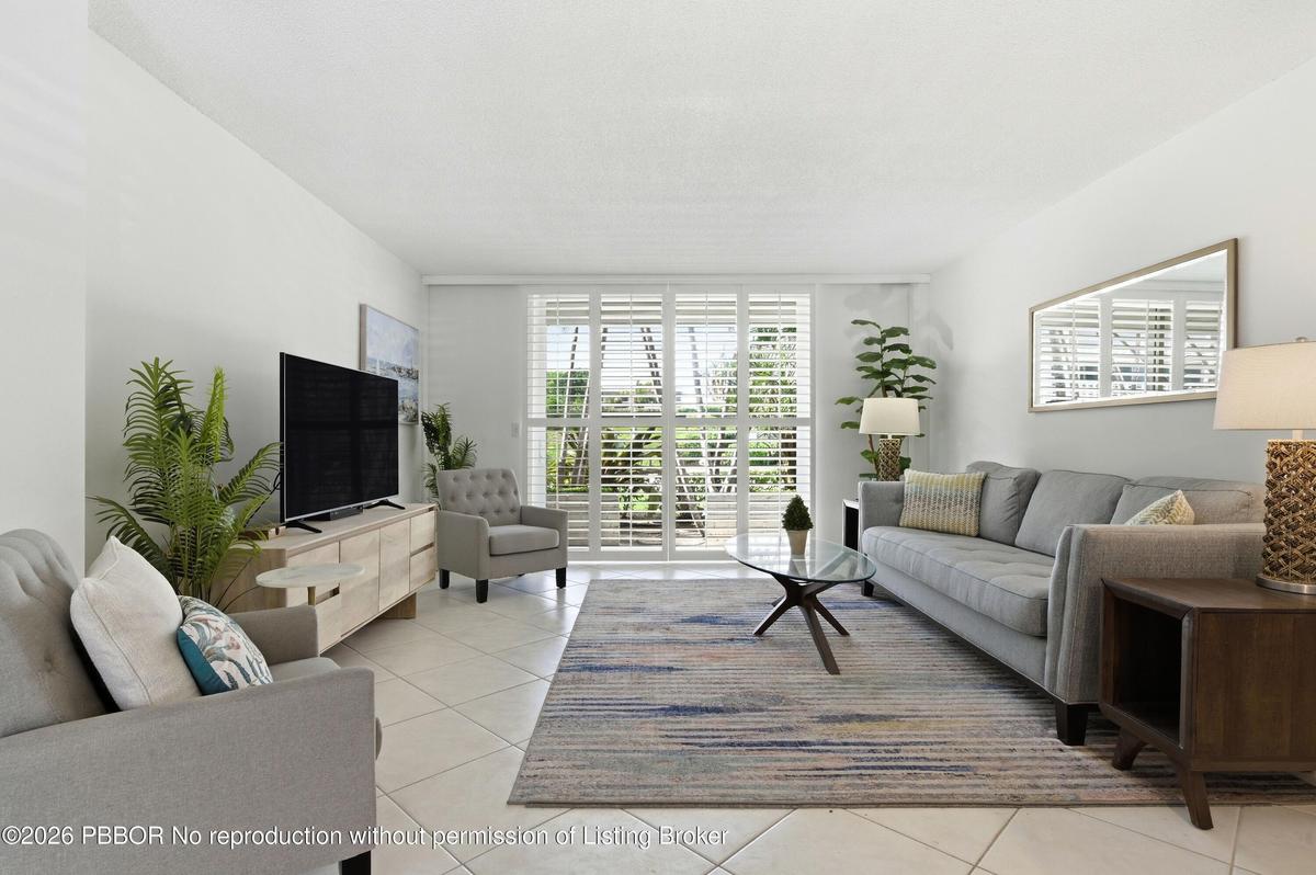 Lovely views of gardens from this open floor plan condominium in sought after complex