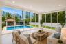 Staged with pool and glass doors all around
