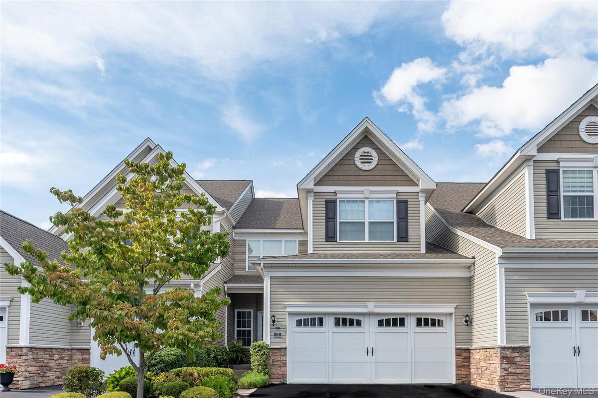 Front of townhome with 2 car garage