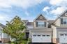 Front of townhome with 2 car garage