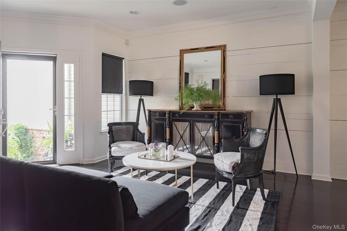 Livingroom/open floorplan with hardwood floors and beamed ceilings