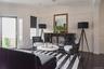 Livingroom/open floorplan with hardwood floors and beamed ceilings